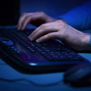 Hacker hacking the server in the dark room