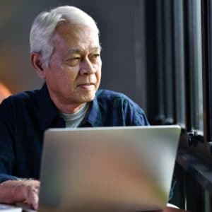Senior man with computer